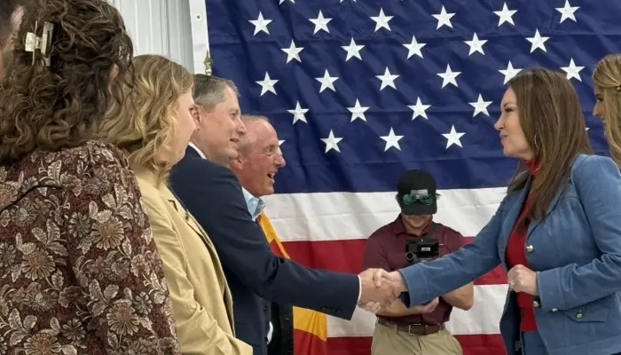 brooke rollins shakes hand